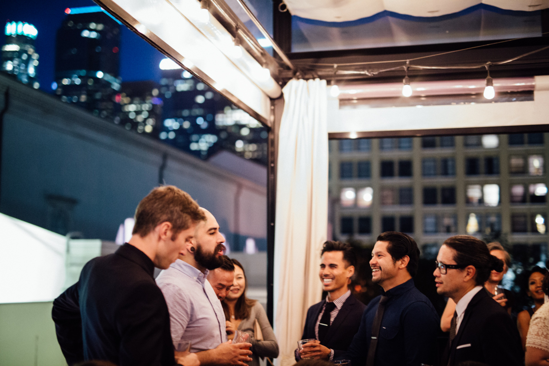 A group of friends chatting during a formal event