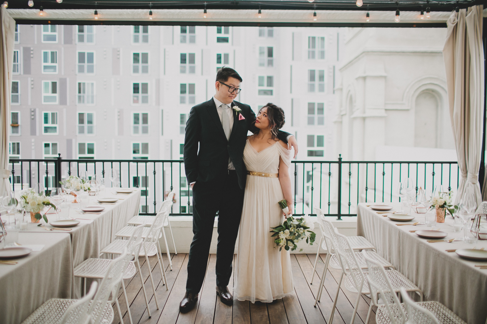 A bride and groom posing at Redbird