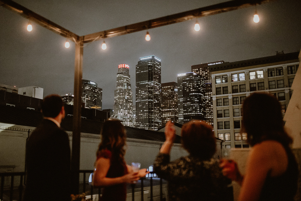 People on Balcony facing Downtown LA Skyline