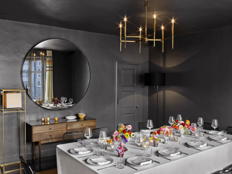 Grey Room with set table and yellow and pink flowers