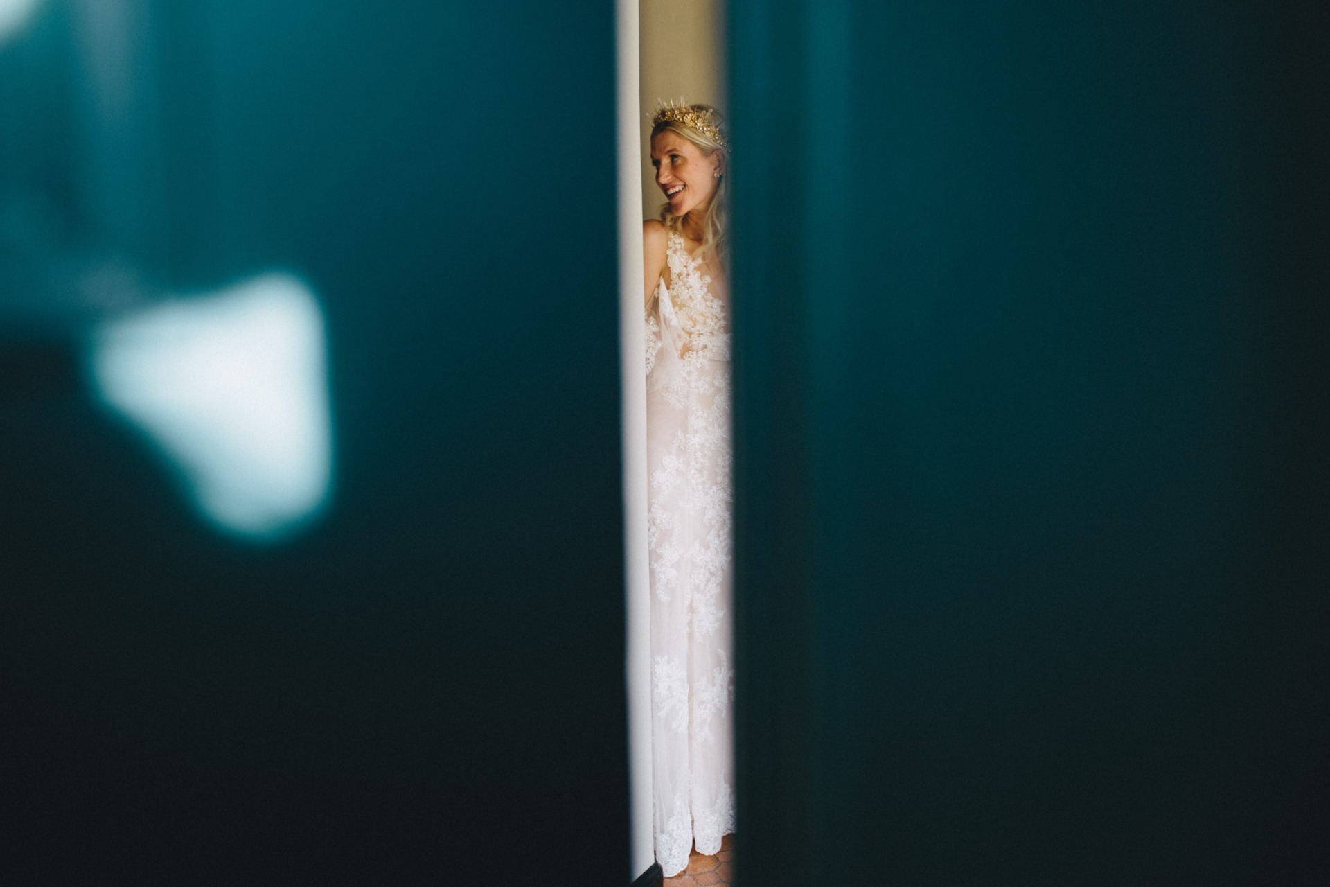 bride surrounded by teal walls