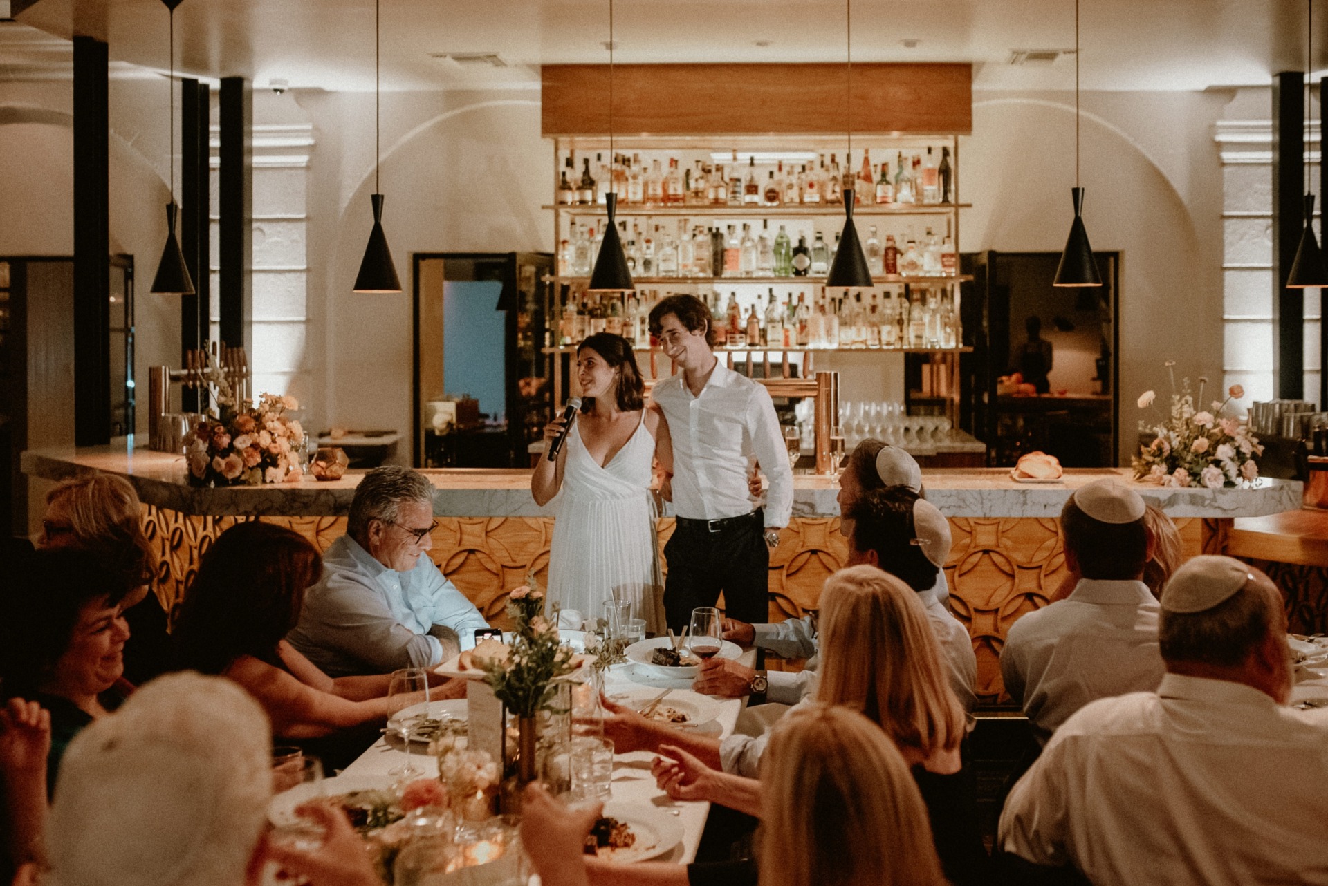 bride and groom giving a speech