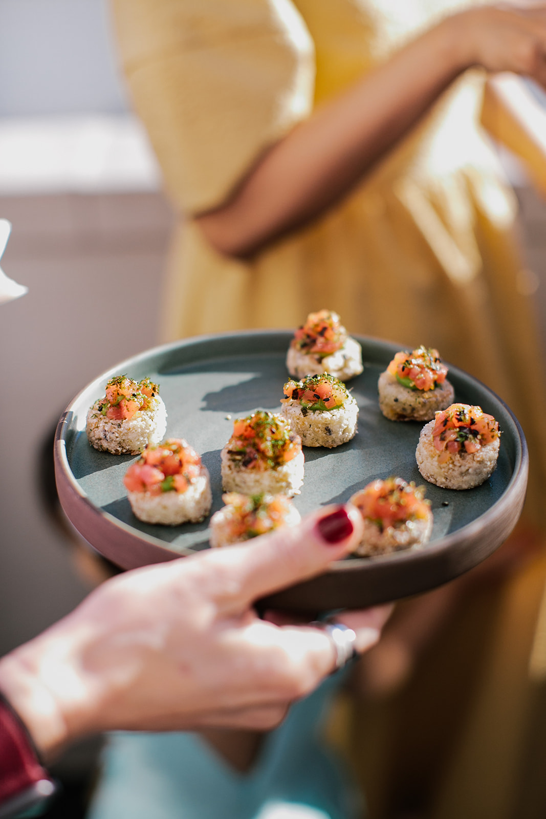 a plate of Albacore Poké hors d'oeuvres at a wedding reception at Redbird DTLA in the Cardinal's Quarters