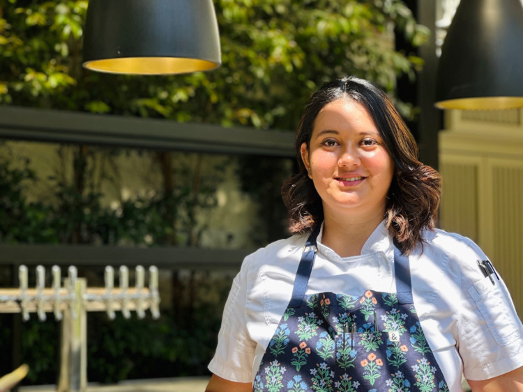 woman in apron smiling