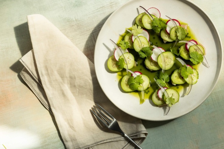 plate of hamachi crudo with cucumbers