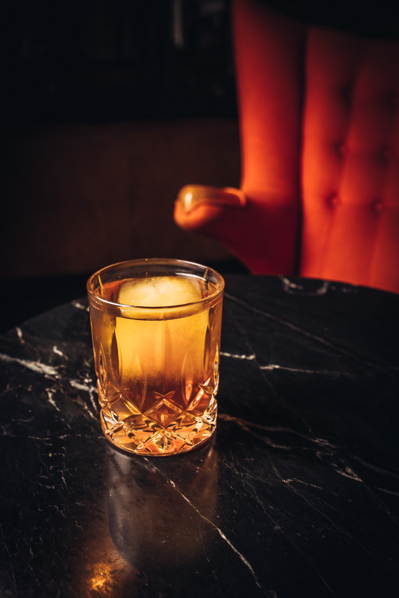 an Old Fashioned sits on a table. dtla sazerac o.f.c. vintage bourbon dinner