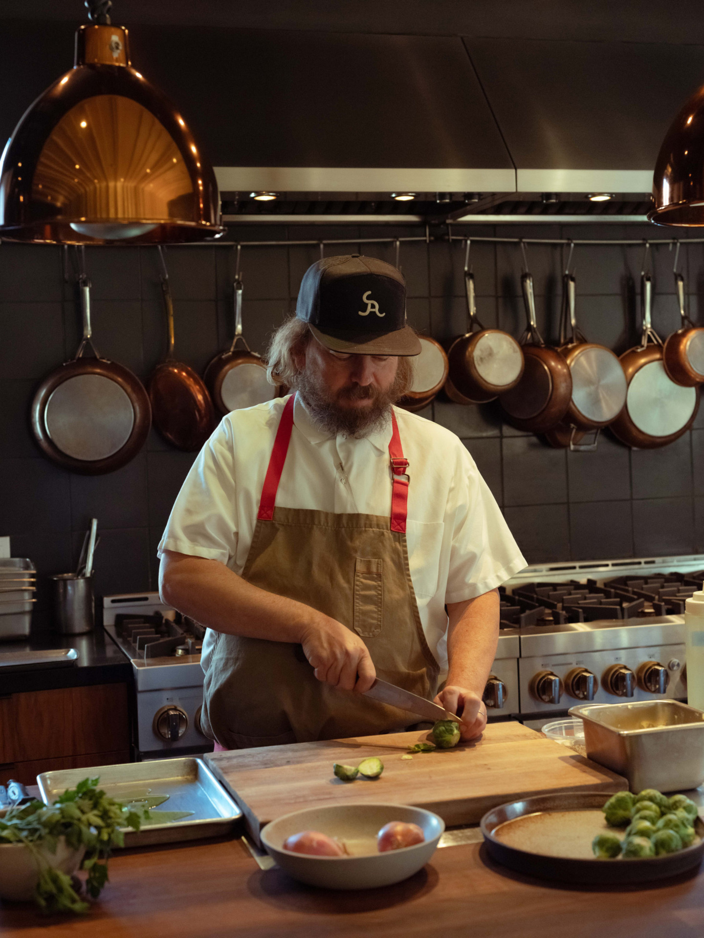 Chef Neal Fraser prepping food in the Redbird East Room