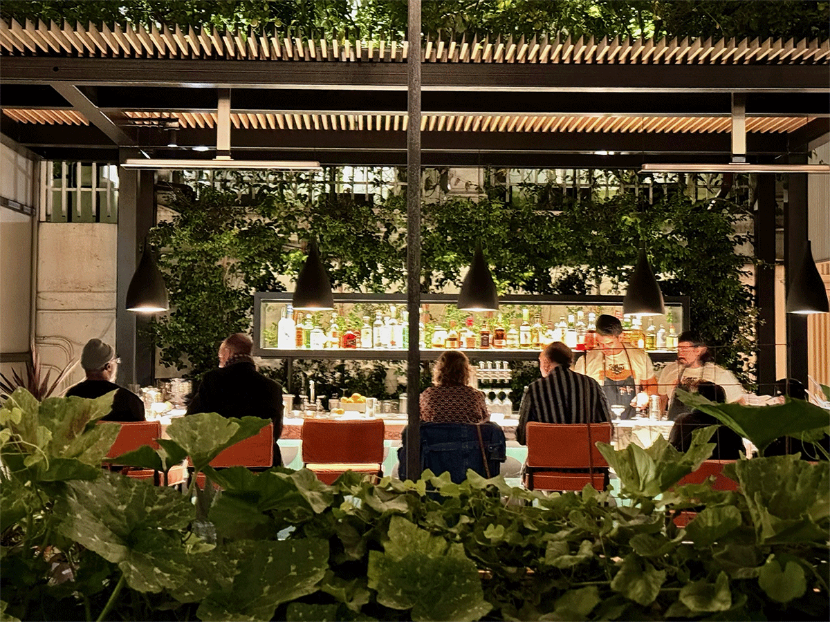 bar guests seated at the Redbird Garden bar in DTLA