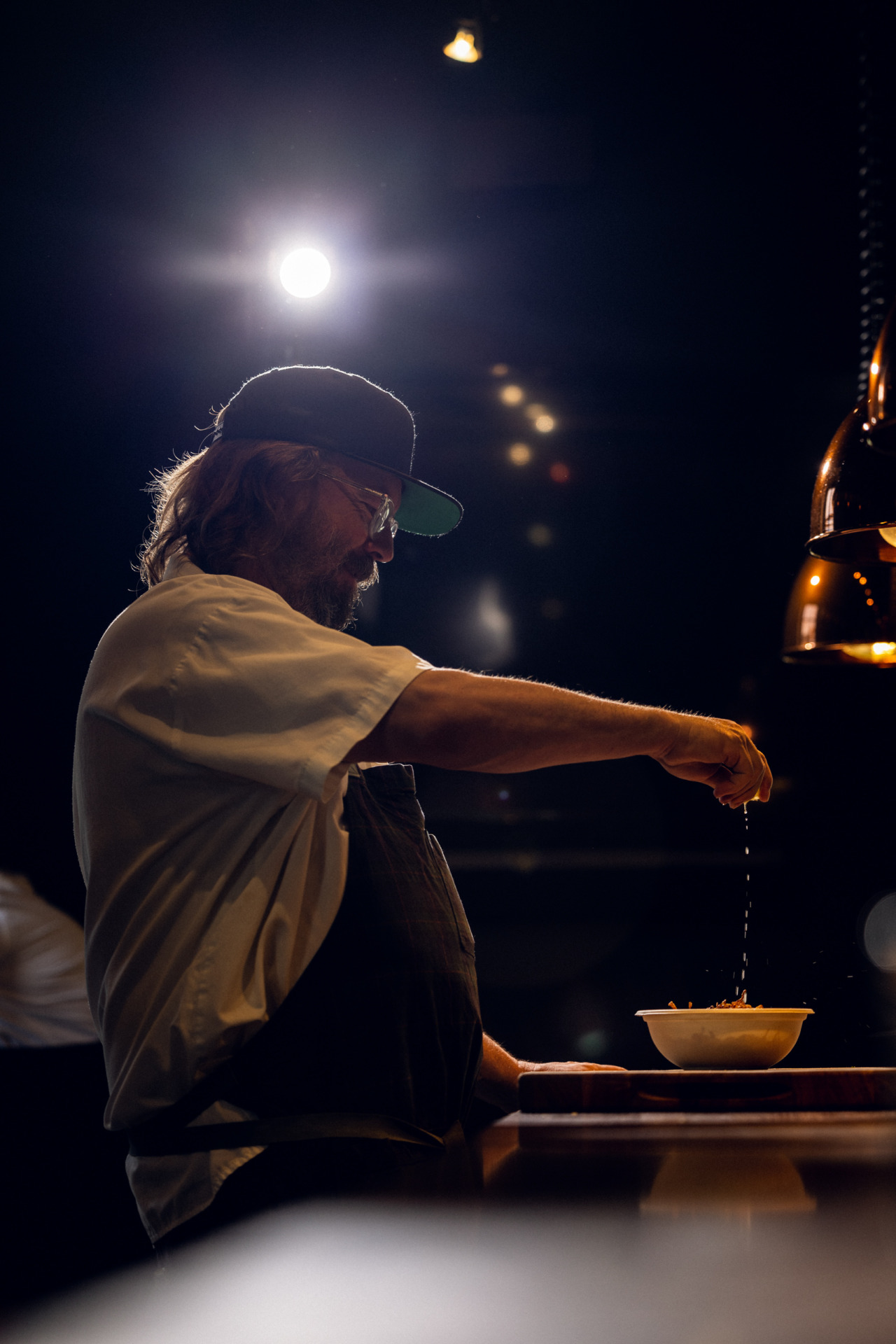 chef neal fraser prepping food in the east room kitchen