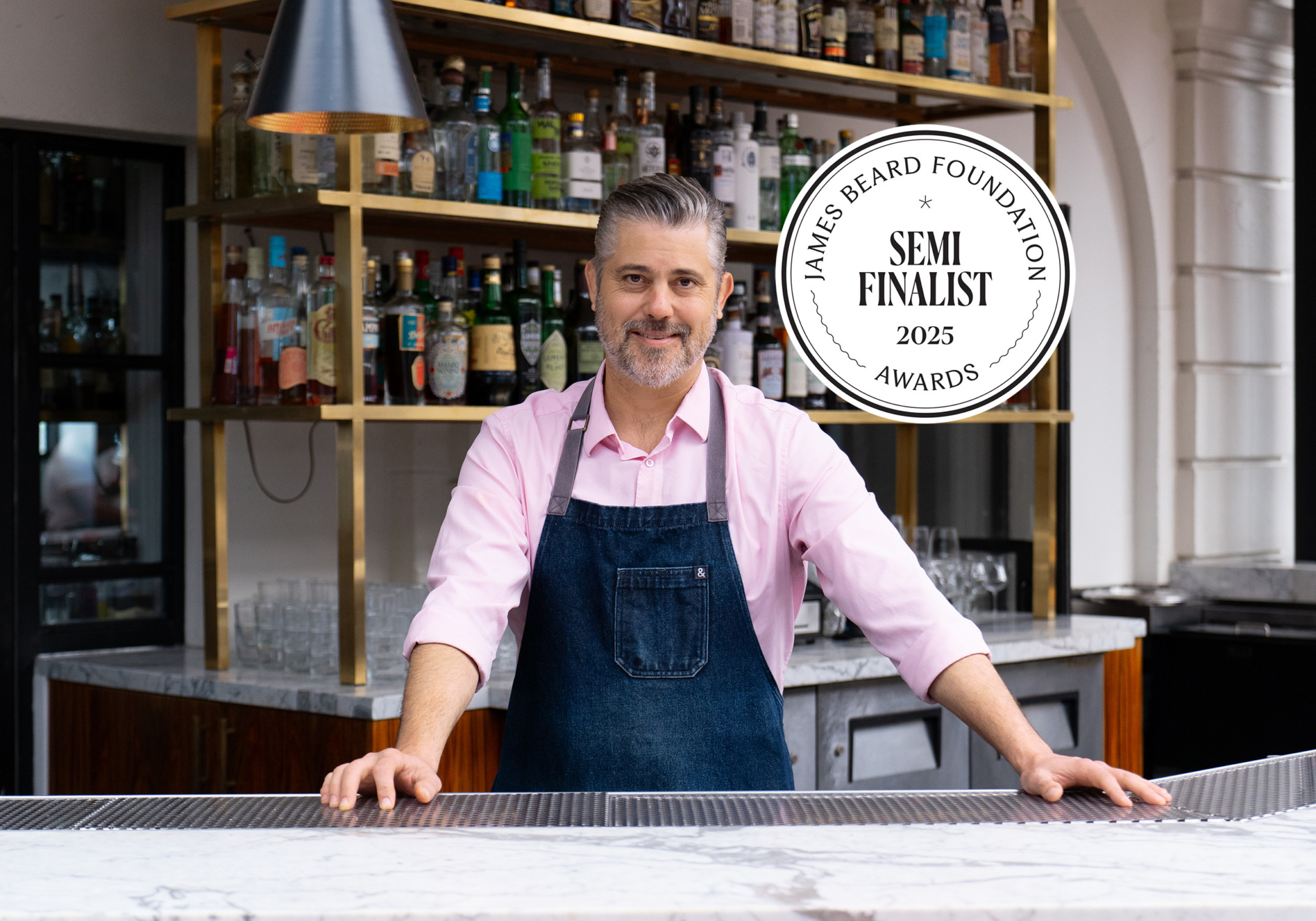 tobin shea, bar master at redbird restaurant in downtown Los Angeles, poses at his bar