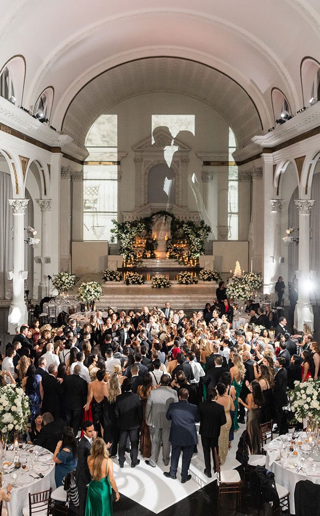 A wedding party in the Vibiana Main Hall at Redbird | Vibiana