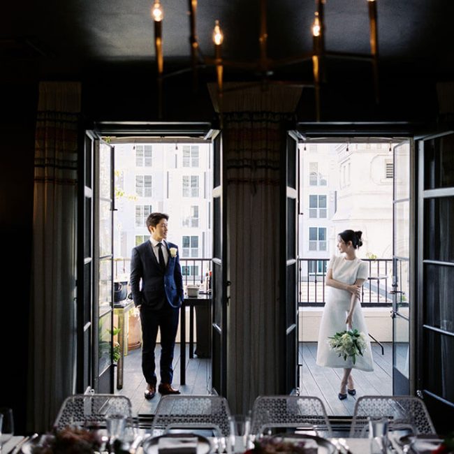 A wedding couple posing for photos in the Bishop's Perch at Redbird | Vibiana