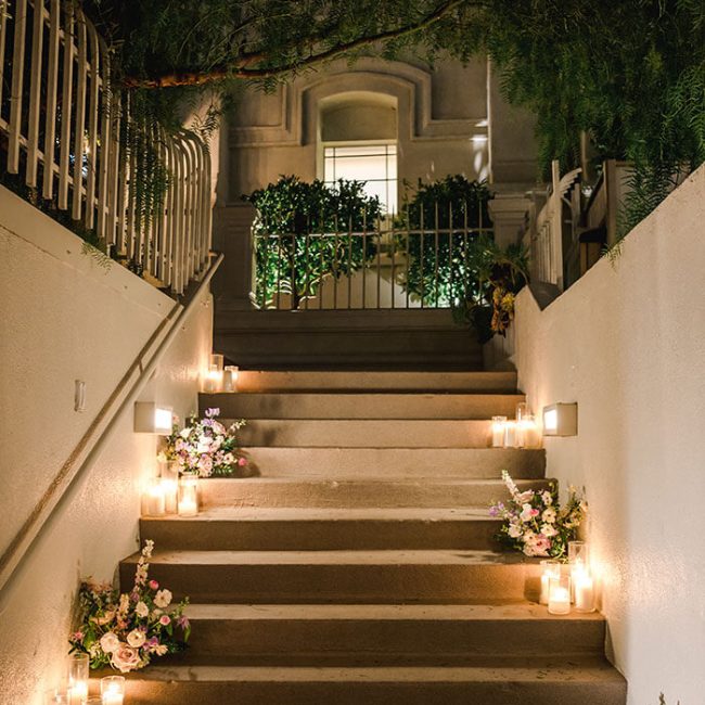 Candlelit steps leading into The Garden at Redbird | Vibiana