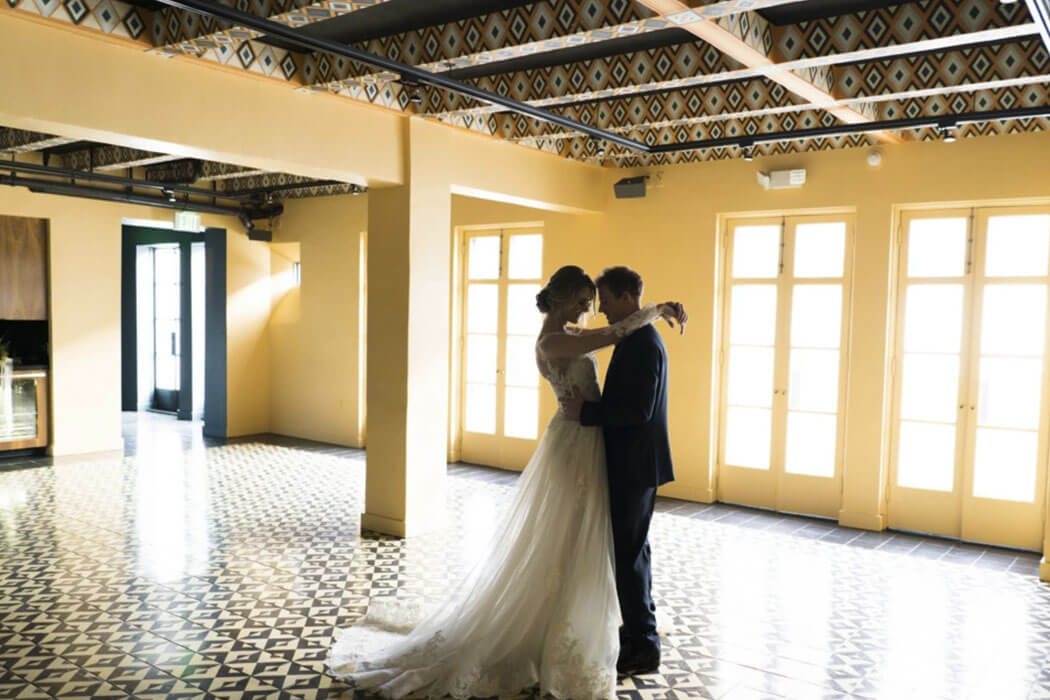 A couple enjoy a moment in The West Room at Redbird | Vibiana