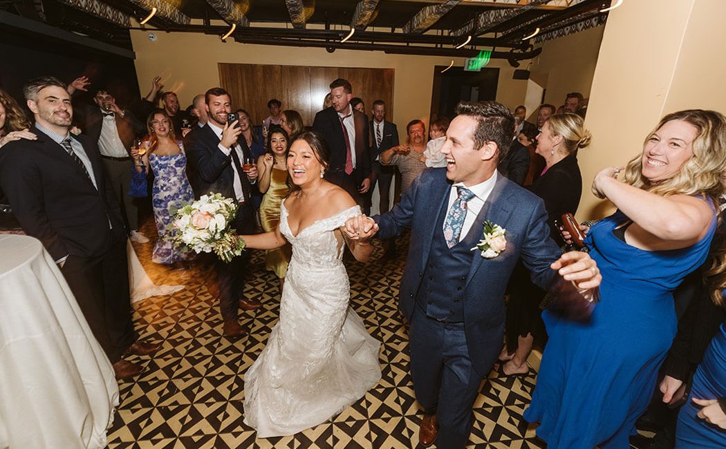 Wedding couple celebrating in the West Room at Redbird | Vibiana