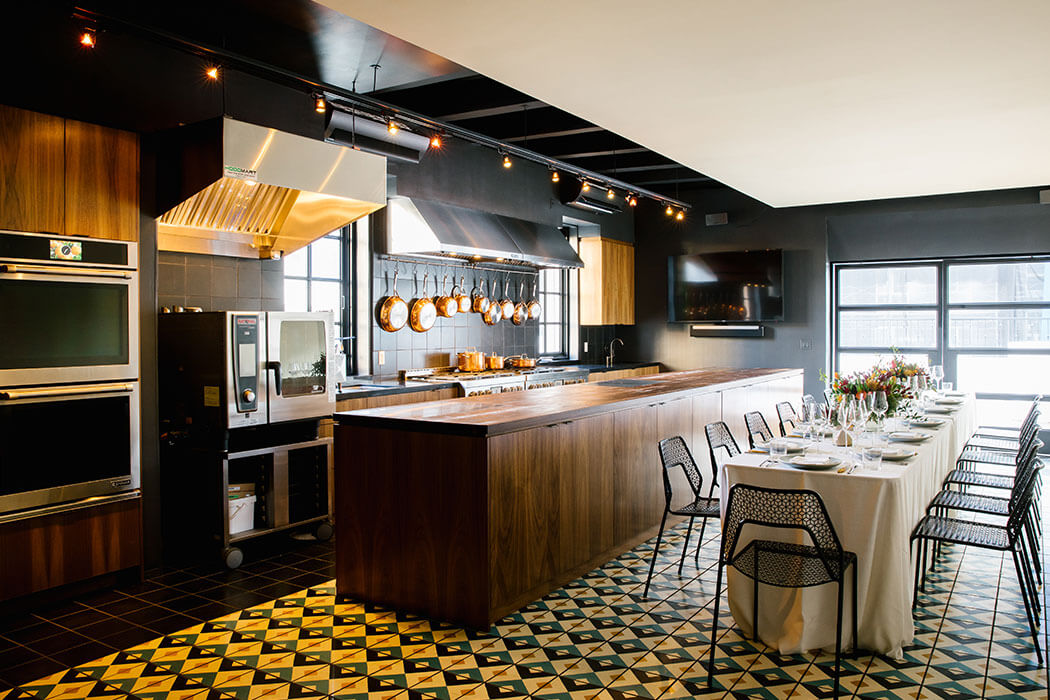 The kitchen and dining room of the East Room at Redbird | Vibiana