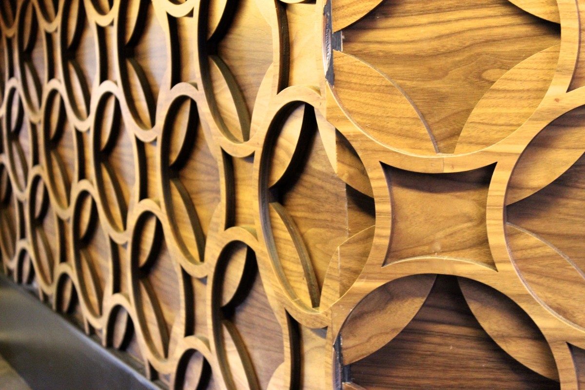 Close up of wood wall carved with circular patterns