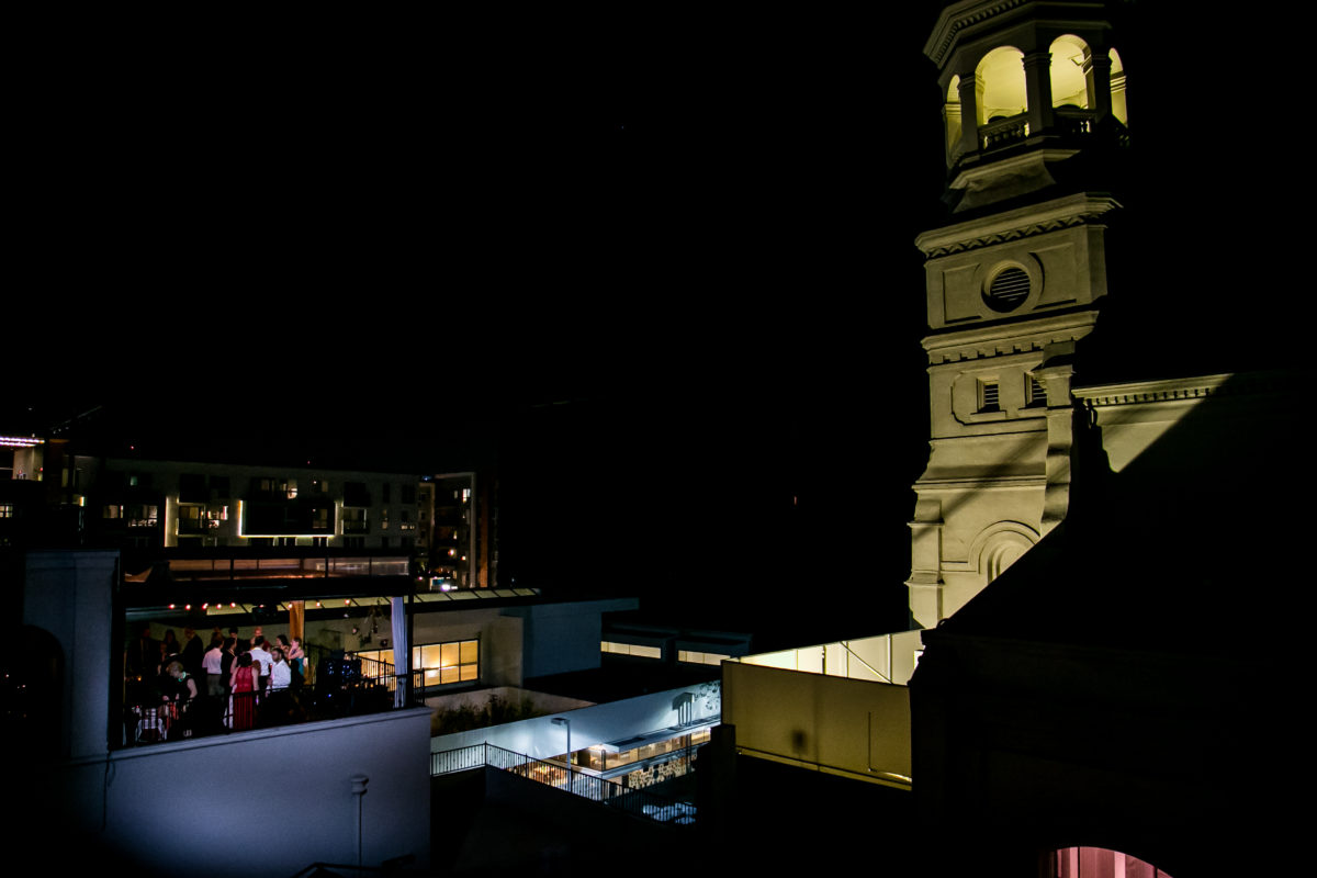 A night view of the balcony with alongside the neighboring church tower