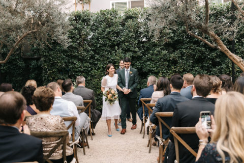 bride and groom walking down aisle after ceremony