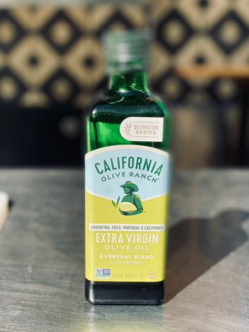bottle of California olive ranch olive oil on table