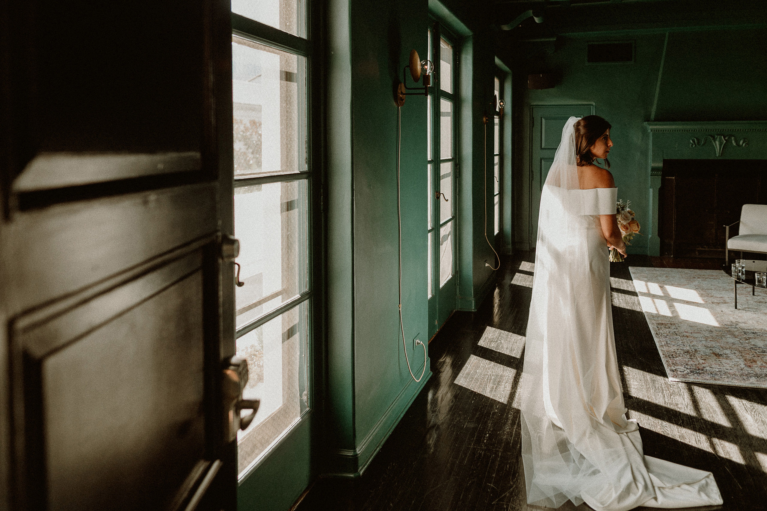 bride in room with green painted walls
