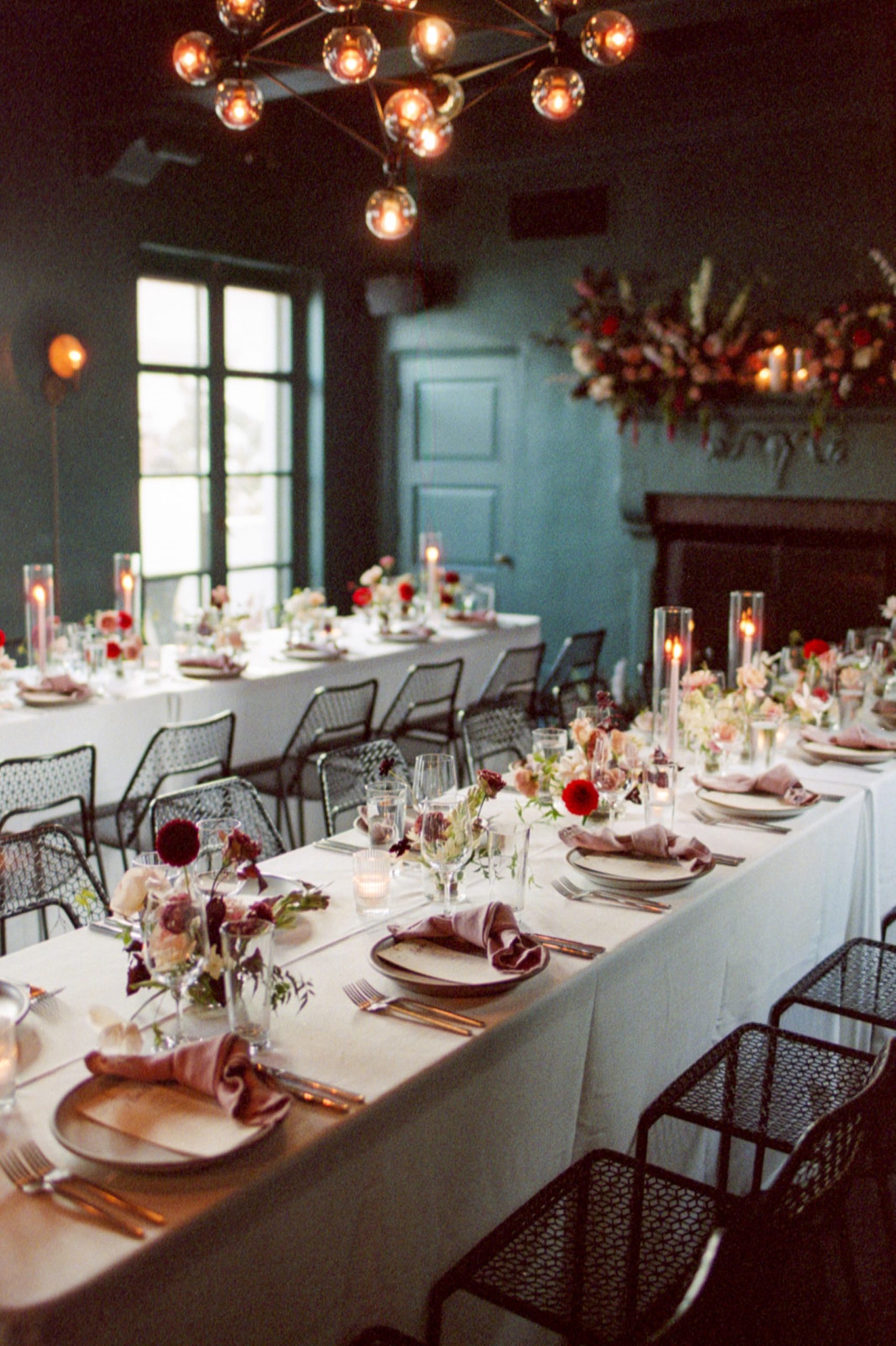 chairs and tables and flowers set for a long party
