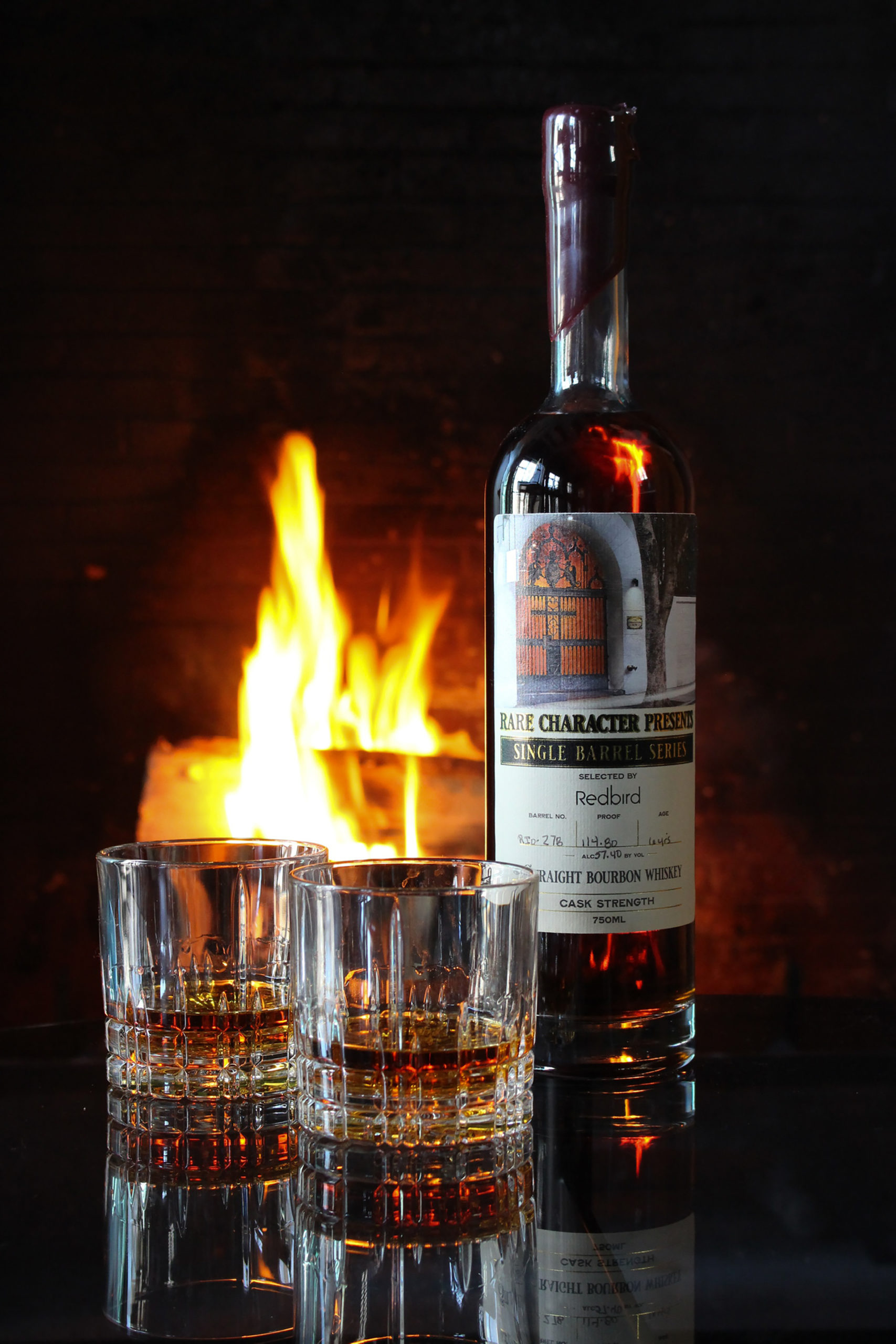 bourbon, rare character on a table with fireplace in background