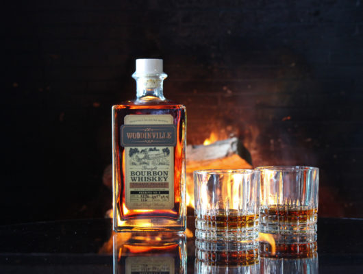 woodinville bourbon whiskey in front of a fire