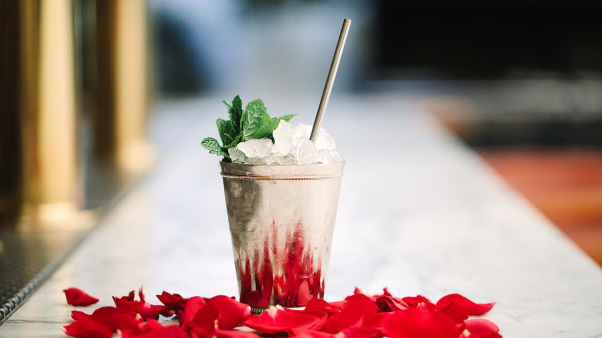 mint julep on bar with flowers