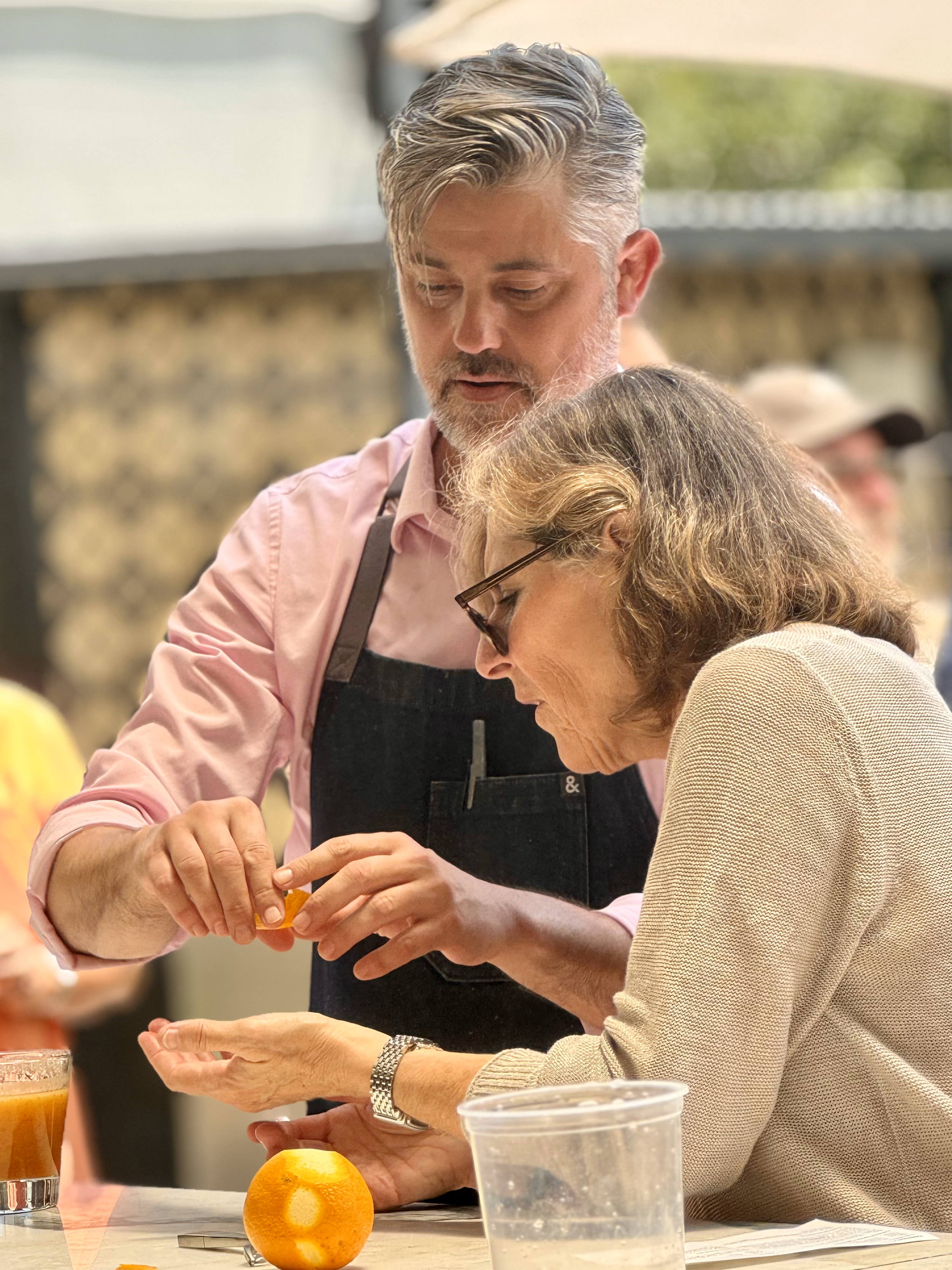 tobin shea showing a guest how to peel an orange